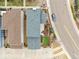 An aerial view of a home with a well-maintained yard and a driveway with a parked car at 9791 Dunning Cir, Highlands Ranch, CO 80126