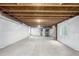 Unfinished basement with a concrete floor, white walls and visible ceiling structure at 9791 Dunning Cir, Highlands Ranch, CO 80126