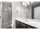 Light-filled bathroom featuring a single sink vanity and tub/shower combo at 9791 Dunning Cir, Highlands Ranch, CO 80126