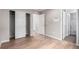 This bedroom offers wood-look floors, neutral walls and sliding closet doors at 9791 Dunning Cir, Highlands Ranch, CO 80126