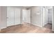 This bedroom offers wood-look floors, neutral walls and sliding closet doors at 9791 Dunning Cir, Highlands Ranch, CO 80126