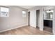 Light and bright bedroom with plank floors, dual windows and a closet for storage at 9791 Dunning Cir, Highlands Ranch, CO 80126