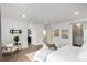 Spacious bedroom with an ensuite bathroom, walk-in closet, and comfortable decor at 9791 Dunning Cir, Highlands Ranch, CO 80126