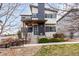 Inviting two-story home boasting a modern exterior design, covered front porch, and easy access with landscaping at 9791 Dunning Cir, Highlands Ranch, CO 80126
