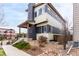 Charming two-story home featuring a modern design with a covered porch, and low maintenance landscaping at 9791 Dunning Cir, Highlands Ranch, CO 80126
