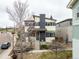 Attractive two-story home featuring a welcoming front porch and nicely landscaped front yard at 9791 Dunning Cir, Highlands Ranch, CO 80126