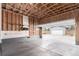 Spacious two car garage showing an open overhead door leading to backyard at 9791 Dunning Cir, Highlands Ranch, CO 80126
