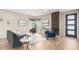 Bright and stylish living room with wood floors, comfortable seating, and modern decor at 9791 Dunning Cir, Highlands Ranch, CO 80126
