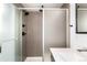 Updated shower with matte black shower head and controls, set against large grey tile at 9791 Dunning Cir, Highlands Ranch, CO 80126