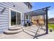 Back patio features a pergola and seating, ideal for outdoor entertaining and relaxation at 11753 Elizabeth Cir, Thornton, CO 80233