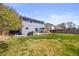 Spacious back yard with a well-manicured lawn, patio area, and privacy fence at 11753 Elizabeth Cir, Thornton, CO 80233