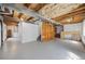 Unfinished basement with exposed ceiling and duct work offers potential for customization at 11753 Elizabeth Cir, Thornton, CO 80233