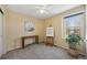 Inviting bedroom with a spacious window, ceiling fan, and neutral colors for a peaceful retreat at 11753 Elizabeth Cir, Thornton, CO 80233
