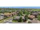 Aerial view of a neighborhood featuring mature trees, well-manicured lawns, and beautiful homes in a suburban setting at 11422 W Cooper Ave, Littleton, CO 80127