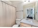 Modest bathroom with a shower/tub combo, vanity and a view of the home office at 11422 W Cooper Ave, Littleton, CO 80127