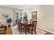 Cozy dining room featuring hardwood floors, chandelier lighting, and a sliding door to the outside at 11422 W Cooper Ave, Littleton, CO 80127
