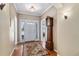 Elegant foyer featuring hardwood floors, a classic grandfather clock, and ample natural light at 11422 W Cooper Ave, Littleton, CO 80127