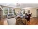 Bright and spacious living room with hardwood floors, large windows, and comfortable seating at 11422 W Cooper Ave, Littleton, CO 80127