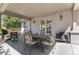 Enjoy outdoor living on this cozy covered patio with seating, perfect for gatherings and relaxation at 11422 W Cooper Ave, Littleton, CO 80127