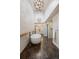Modern bathroom with a free standing tub, designer lighting, and beautiful wall and floor tiles at 30886 County Road 17/21, Elizabeth, CO 80107