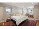 Inviting bedroom featuring a comfortable bed, hardwood floors, and large windows providing natural light at 30886 County Road 17/21, Elizabeth, CO 80107