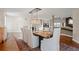Bright dining room featuring a modern chandelier, hardwood floors, and lots of natural light at 30886 County Road 17/21, Elizabeth, CO 80107