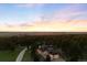 A dramatic sunset over the home with acreage in the Colorado mountains at 30886 County Road 17/21, Elizabeth, CO 80107