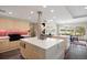 Spacious kitchen features stone floors, breakfast bar, luxury appliances, and mountain views at 30886 County Road 17/21, Elizabeth, CO 80107