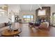 Living room with wood floors, fireplace and expansive windows to the property at 30886 County Road 17/21, Elizabeth, CO 80107
