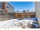 Backyard with fire pit and partially visible fence at 12353 W Saratoga Ave, Morrison, CO 80465