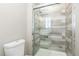 Bathroom with a walk-in shower and updated fixtures at 12353 W Saratoga Ave, Morrison, CO 80465