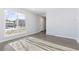 Living room with hardwood floors and large window at 12353 W Saratoga Ave, Morrison, CO 80465