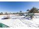 Snowy playground with various play equipment for children at 12353 W Saratoga Ave, Morrison, CO 80465