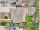 Aerial view of the property showcases the backyard, detached garage, and well maintained landscaping at 5540 E Jewell Ave, Denver, CO 80222