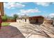 A well-maintained backyard featuring a concrete patio and yard at 5540 E Jewell Ave, Denver, CO 80222