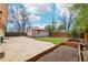 Well maintained backyard featuring a detached garage and raised garden beds at 5540 E Jewell Ave, Denver, CO 80222