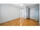 Bedroom featuring hard wood floors and closet with custom curtain at 5540 E Jewell Ave, Denver, CO 80222