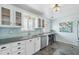 Well-lit kitchen featuring granite countertops, modern appliances, and plenty of natural light at 5540 E Jewell Ave, Denver, CO 80222