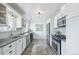 Modern kitchen featuring stainless steel appliances, granite countertops, and ample storage at 5540 E Jewell Ave, Denver, CO 80222