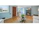 Open living space featuring hardwood floors, fireplace, and warm lighting at 5540 E Jewell Ave, Denver, CO 80222