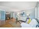 Cozy living room with a charming fireplace, plush seating, and natural light from a window at 5540 E Jewell Ave, Denver, CO 80222