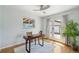 Bright office features a modern desk, stylish chair and french doors at 5540 E Jewell Ave, Denver, CO 80222