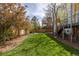 Extensive backyard features mature trees, a lush lawn, and a stone patio at 942 S Fulton St, Aurora, CO 80247