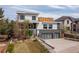 Modern home with stylish three-car garage and well-manicured front lawn at 942 S Fulton St, Aurora, CO 80247