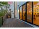 Modern home with a spacious deck and large windows reflecting the interior at 942 S Fulton St, Aurora, CO 80247