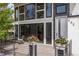Inviting front porch with modern railing and decorative flowerpots at 942 S Fulton St, Aurora, CO 80247