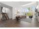 Spacious living room boasts high ceilings, large windows, hardwood floors, and a stone fireplace at 942 S Fulton St, Aurora, CO 80247