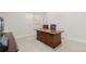 Spacious home office featuring a wooden desk, a comfortable chair and natural light from a window at 942 S Fulton St, Aurora, CO 80247