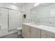 Clean bathroom with sleek shower, modern vanity, and ample lighting, offering a relaxing atmosphere at 942 S Fulton St, Denver, CO 80247