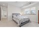 Comfortable bedroom with large window and carpet flooring, offering a bright and cozy space at 942 S Fulton St, Denver, CO 80247